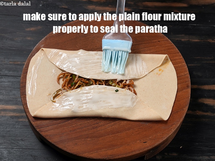 Step 41 – Make sure to apply the plain flour mixture properly to seal the paratha.