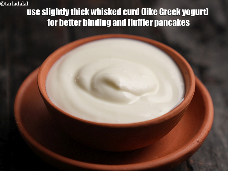 Step 25 – Use slightly thick whisked curd (like Greek yogurt) for better binding and fluffier pancakes.