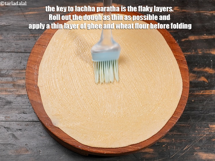 Step 38 – The key to lachha paratha is the flaky layers. Roll out the dough as thin …