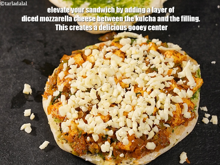 Step 32 – Elevate your sandwich by adding a layer of diced mozzarella cheese between the kulcha and …