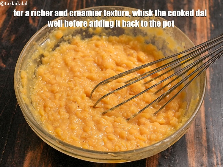 Step 51 – For a richer and creamier texture, whisk the cooked dal well before adding it back …
