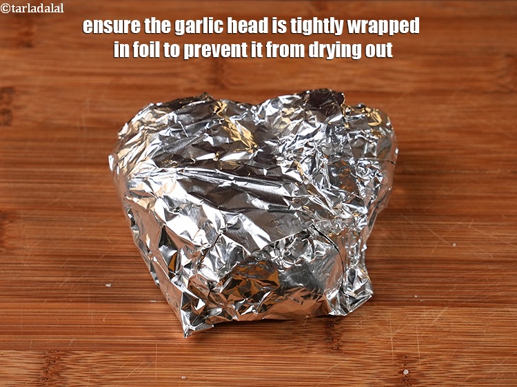 Step 20 – Ensure the garlic head is tightly wrapped in foil to prevent it from drying out.<br …