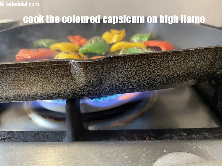 Step 16 – Cook the coloured capsicum on a high flame.