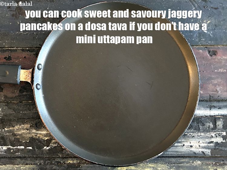 Step 18 – You can cook the <strong>savoury sweet jaggery pancakes </strong>on a tava as well.