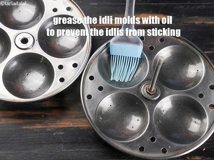 Step 28 – Grease the idli molds with oil to prevent the idlis from sticking.