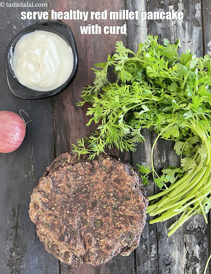 Step 25 – Serve <strong>healthy red millet pancake</strong> with <a href="https://www.tarladalal.com/how-to-make-curd-or-dahi-at-home-2790r">homemade curd</a>.