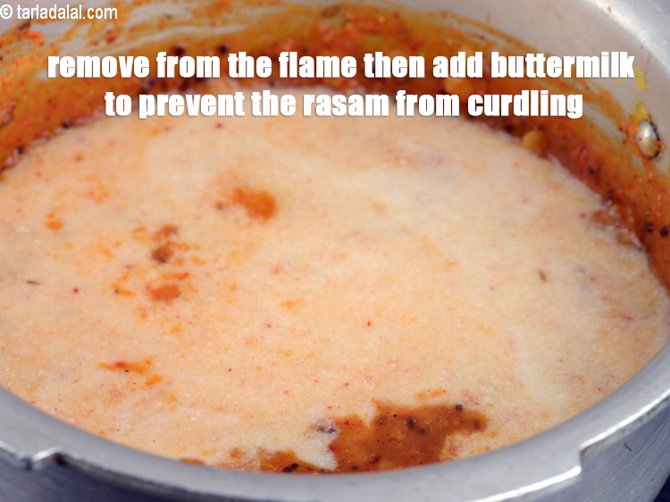 Step 39 – Remove from the flame then add buttermilk to prevent the rasam from curdling.