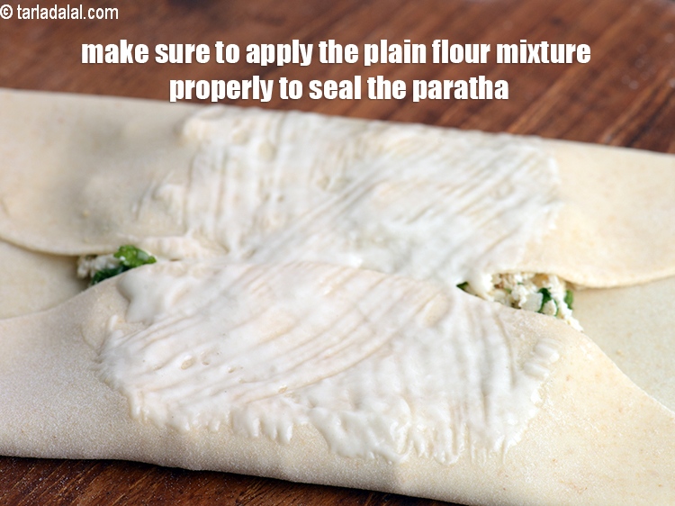 Step 37 – Make sure to apply the plain flour mixture properly to seal the paratha.