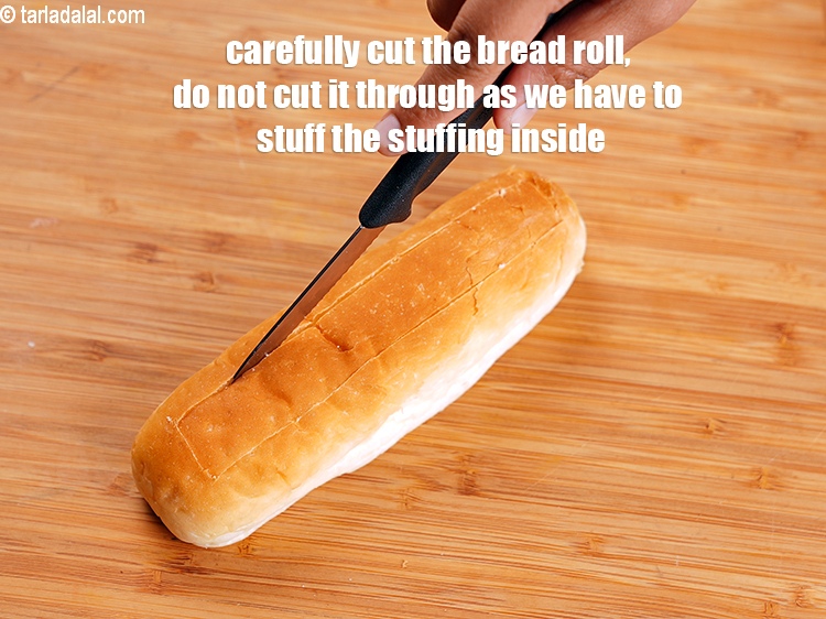 Step 26 – Carefully cut the bread roll, do not cut it through as we have to stuff …