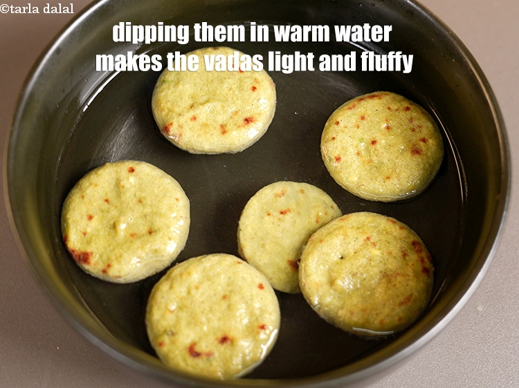 Step 35 – Dipping them in warm water makes the vadas light and fluffy.