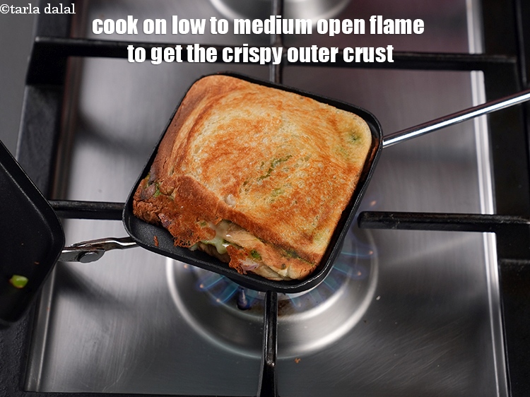 Step 23 – Cook on low to medium open flame to get the crispy outer crust.