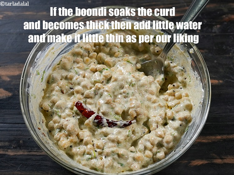 Step 28 – If the boondi soaks the curd and becomes thick then add little water and make …