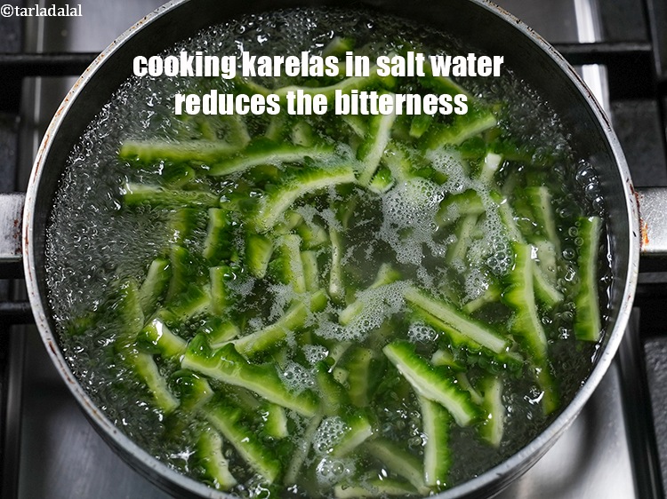 Step 27 – Cooking karelas in salt water reduces the bitterness.