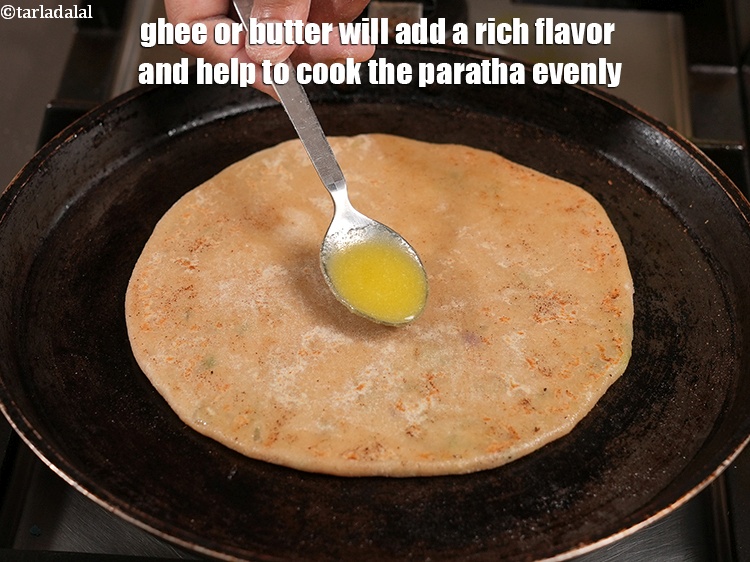 Step 34 – Ghee or butter will add a rich flavor and help to cook the paratha evenly.