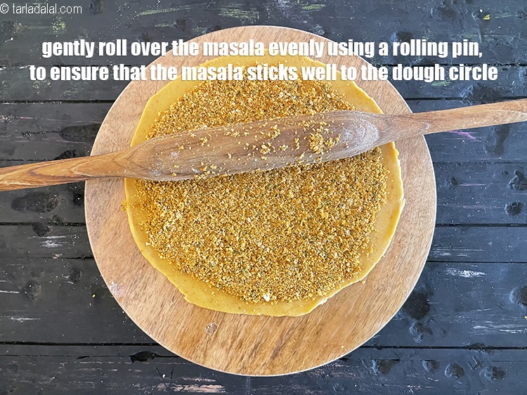 Step 59 – <meta charset="UTF-8" />Gently roll over the masala evenly using a rolling pin,&nbsp;to ensure that the …