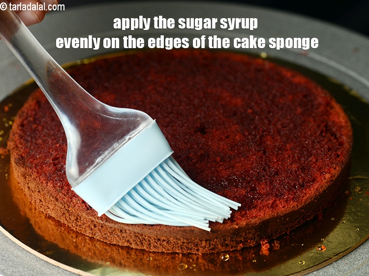 Step 54 – Apply the sugar syrup evenly on the edges of the cake sponge.