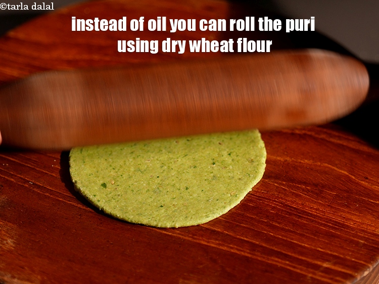 Step 22 – Instead of oil you can roll the puri using dry wheat flour.