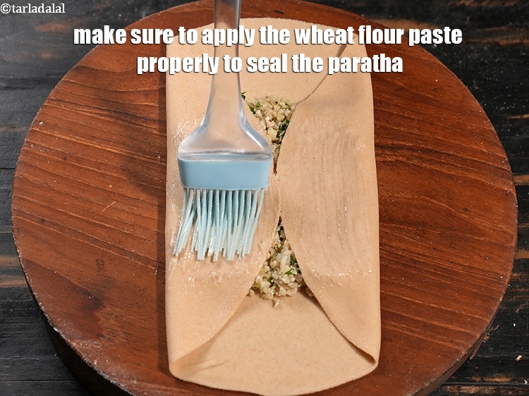 Step 35 – Make sure to apply the wheat flour paste properly to seal the paratha.