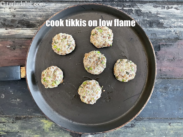 Step 33 – Cooking tikki&#39;s on a low flame is important as we are not deep frying the …