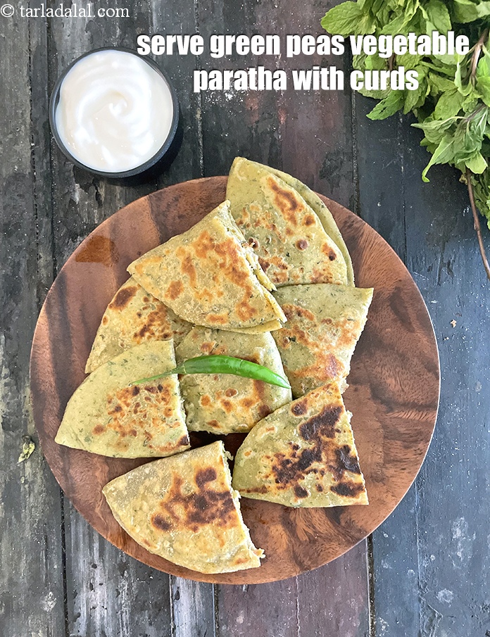 Step 52 – Serve <meta charset="UTF-8" /><strong>green peas vegetable&nbsp;paratha</strong>&nbsp;with curds.&nbsp;See <a href="https://www.tarladalal.com/how-to-make-curd-or-dahi-at-home-2790r">how to make curds</a>.