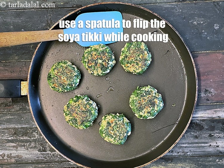Step 40 – Use a spatula to flip the <strong>hara bhara soya tikkis | vegetable soya cutlet | …