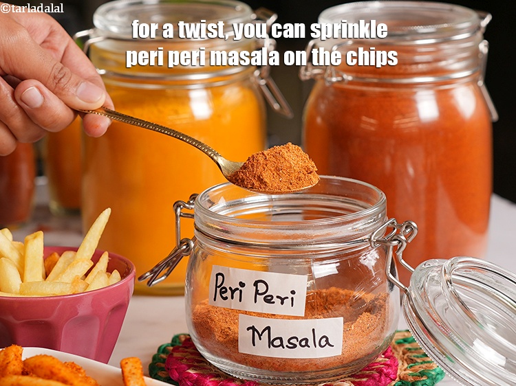 Step 17 – For a twist, you can sprinkle <a href="https://www.tarladalal.com/peri-peri-masala-40207r" target="_blank">peri peri masala</a> on the chips.