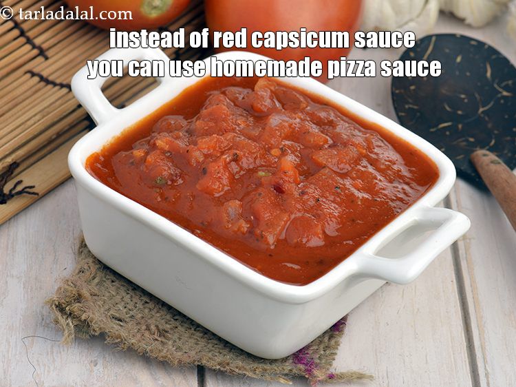 Step 36 – Instead of red capsicum sauce you can use <a href="https://www.tarladalal.com/homemade-pizza-sauce-with-fresh-tomatoes-3250r" target="_blank"><strong>homemade pizza sauce</strong></a>.