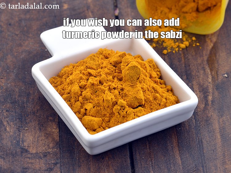 Step 23 – If you wish you can also add turmeric powder in the sabzi.