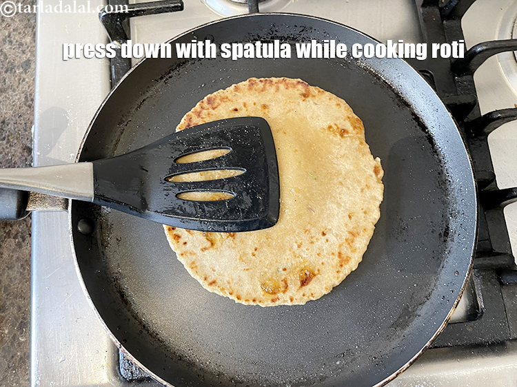Step 23 – Remember to press down regularly&nbsp;on sweet dashmi roti with a spatula to enusre uniform cooking.