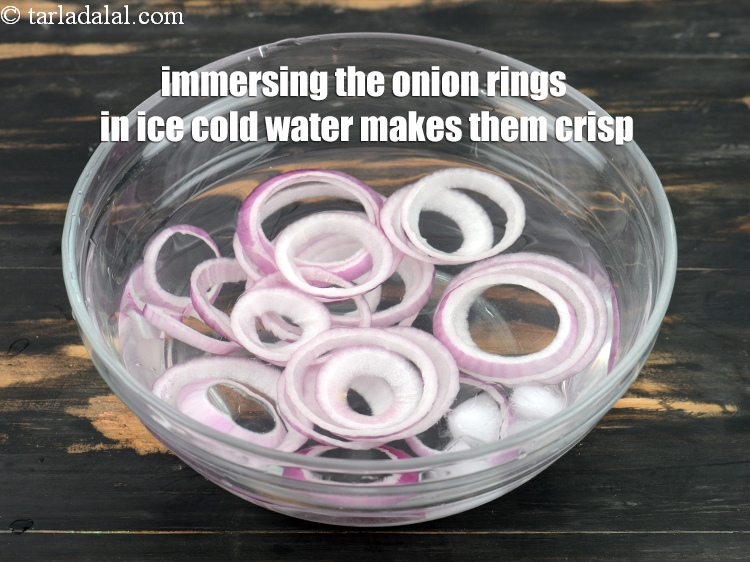 Step 22 – Immersing the onion rings in ice cold water makes them crisp.