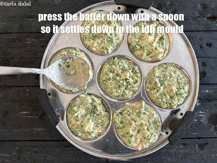 Step 44 – <meta charset="UTF-8" /> Press&nbsp;the batter down with a spoon so it&nbsp;settles down into the idli …