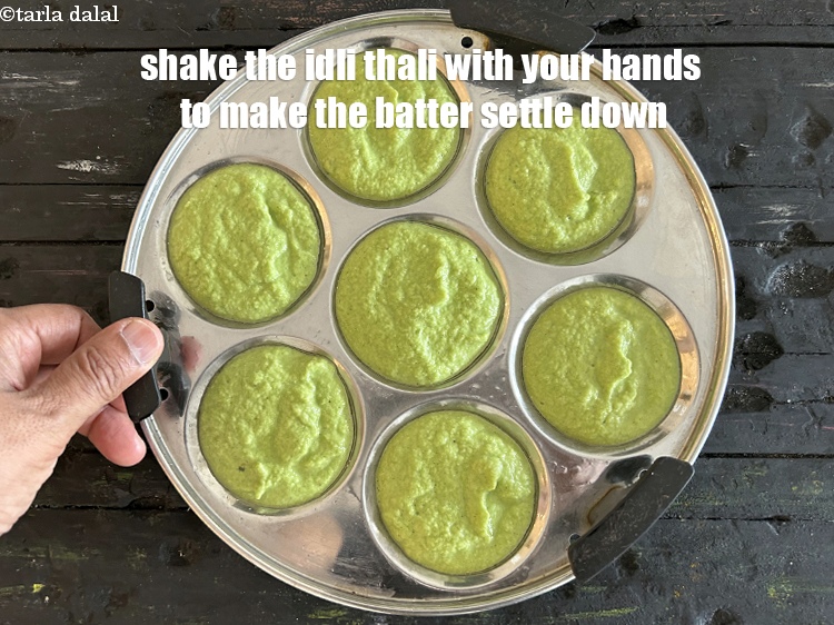 Step 33 – Shake the idli thali with your hands to make the batter settle down.