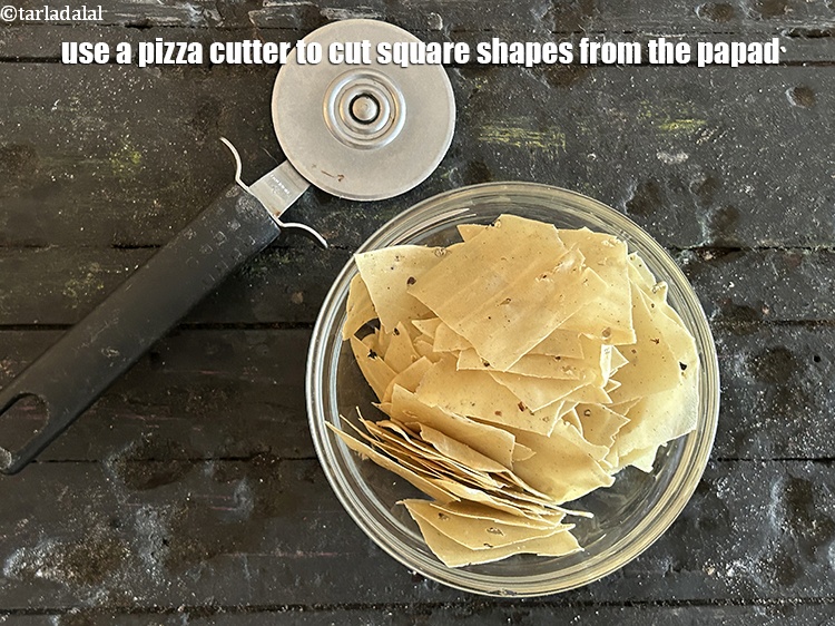 Step 25 – <meta charset="UTF-8" />Use a pizza cutter to cut square shapes from the papad.&nbsp;