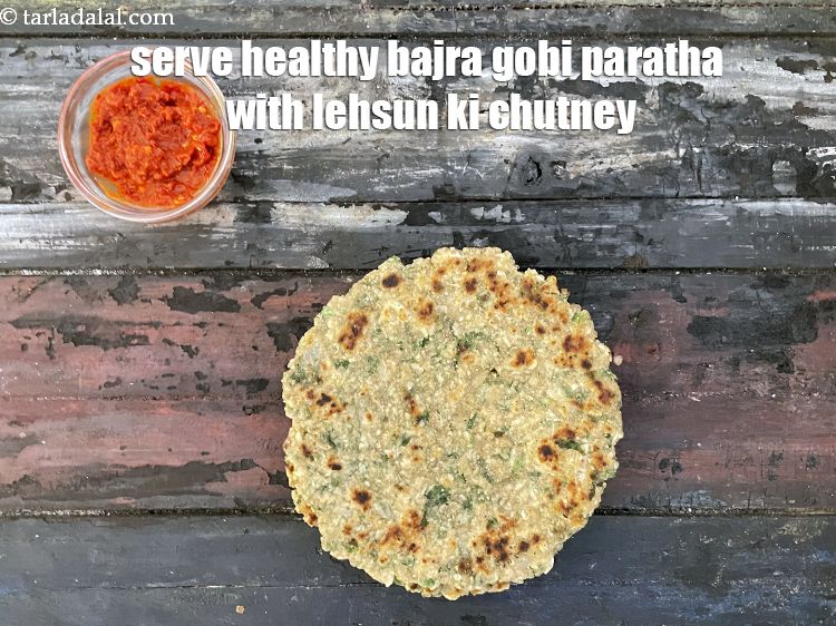 स्टेप 31 – <strong>हेल्दी बाजरा गोभी परांठा&nbsp;</strong><a href=""https://www.tarladalal.com/lahsun-ki-chutney-lehsun-chutney-hindi-3902r"" target=""_blank"">लहसुन की चटनी&nbsp;</a>के साथ&nbsp;परोसें&nbsp;।