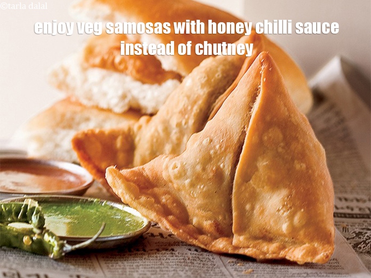 Step 16 – Enjoy <a href="https://www.tarladalal.com/samosa-or-how-to-make-samosa-recipe-37441r">veg samosas</a> with <strong>honey chilli sauce</strong> instead of chutney.&nbsp;