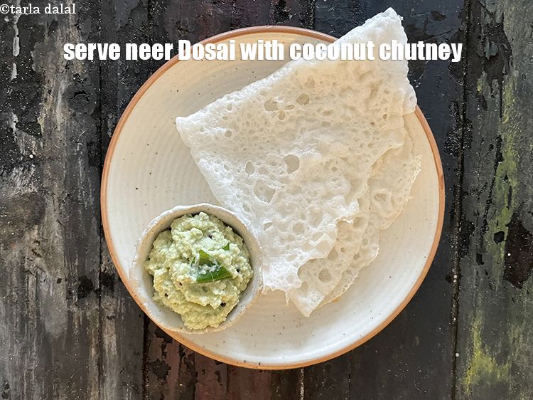 Step 42 – Serve <strong>neer dosai </strong>with coconut chutney.&nbsp;See <a href="https://www.tarladalal.com/coconut-chutney---idlis-and-dosas-1653r">how to make coconut chutney</a>.