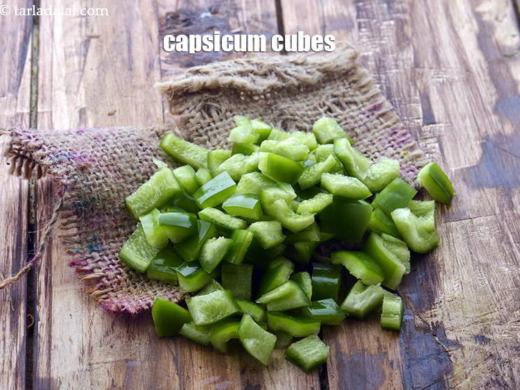 Step 18 – Capsicum cubes would be a flavourful addition in this sabzi. You can add and saut&eacute; …