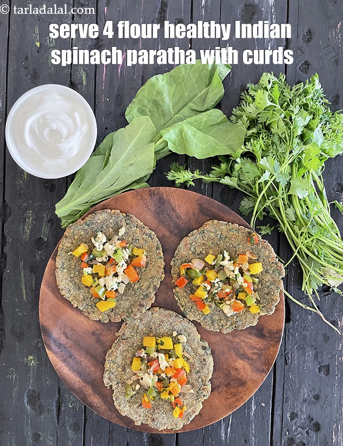 Step 50 – Serve&nbsp;<strong>4 flour healthy Indian spinach paratha&nbsp;</strong>with curds. See <a href="https://www.tarladalal.com/how-to-make-curd-or-dahi-at-home-2790r">how to make curds</a>.