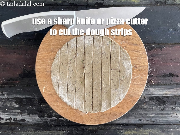 Step 26 – <meta charset="UTF-8" />Cut each dough circle into 9&nbsp;equal size long strips with a sharp knife&nbsp;