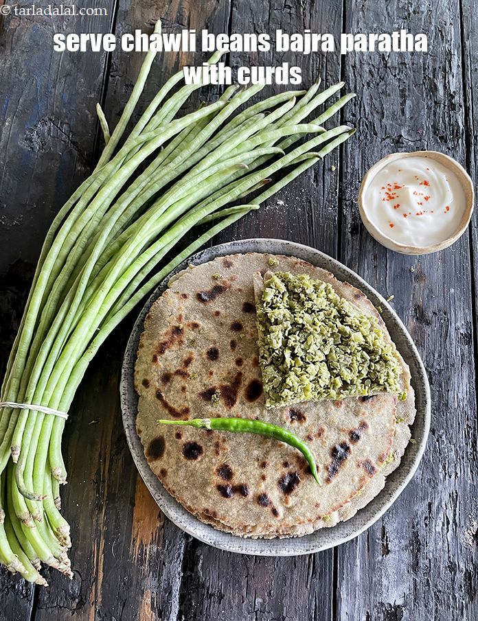 Step 37 – Serve&nbsp;<strong>chawli beans bajra paratha with curds.&nbsp;</strong>See <a href="https://www.tarladalal.com/how-to-make-curd-or-dahi-at-home-2790r">how to make curds</a>.