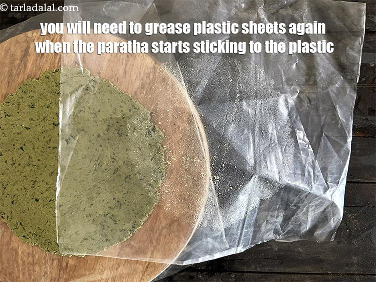 Step 39 – You will need to grease the plastic sheets again as you roll other parathas. If …