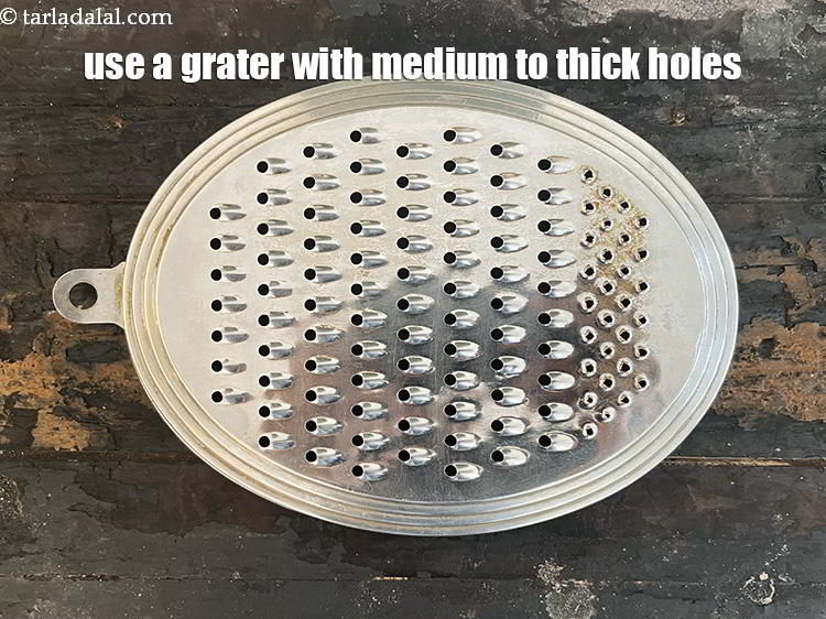 Step 27 – Use a grater with medium to thick holes. Grating the corn cob with thin holes …
