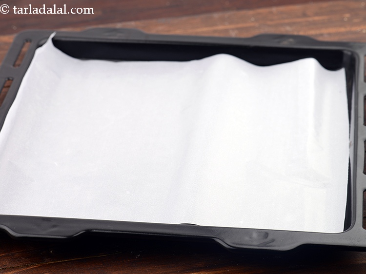 Step 19 – Line the baking tray with butter paper so that cookies do not stick&nbsp;or burn at …