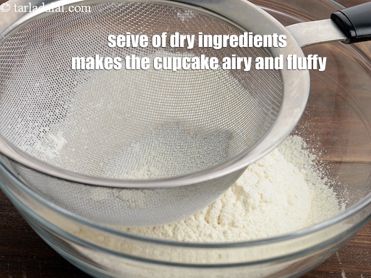 Step 26 – Seive of dry ingredients makes the cupcake airy and fluffy.