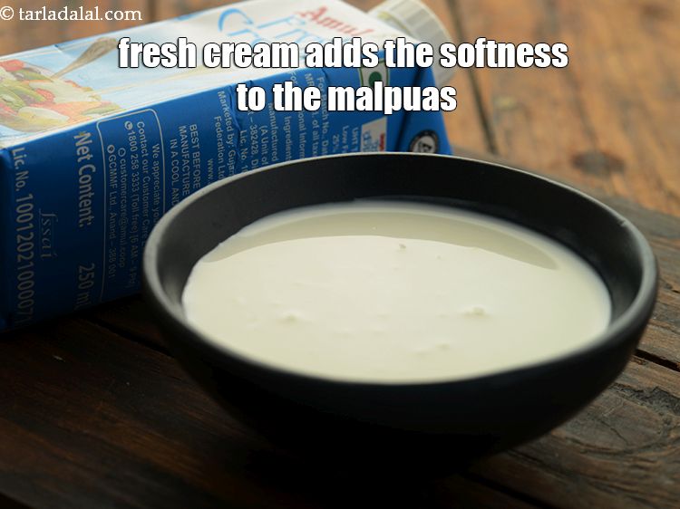 Step 25 – <p>Fresh cream adds the softness to the malpuas.</p>