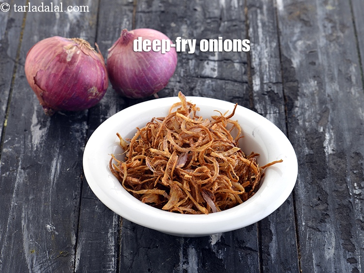 Step 23 – Right way to <a href="https://tarladalal.com/fried-onions-how-to-make-fried-onions-42752r" target="_blank">deep-fry onions.&nbsp;</a>