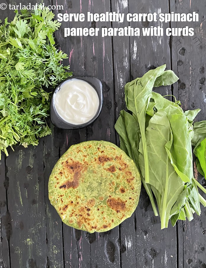 स्टेप 36 – दही के साथ&nbsp;<strong>स्वस्थ गाजर पालक पनीर पराठा</strong>&nbsp;परोसें।