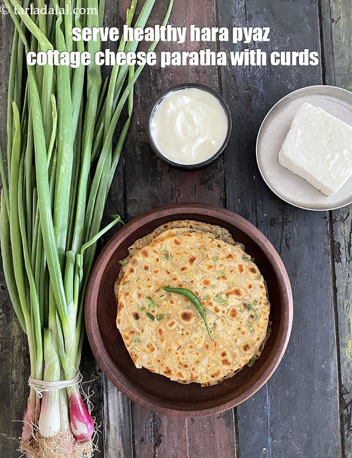 Step 27 – Serve <strong>healthy hara pyaz cottage cheese paratha</strong>&nbsp;with curds.&nbsp;See <a href="https://www.tarladalal.com/how-to-make-curd-or-dahi-at-home-2790r">how to make dahi</a>.&nbsp;