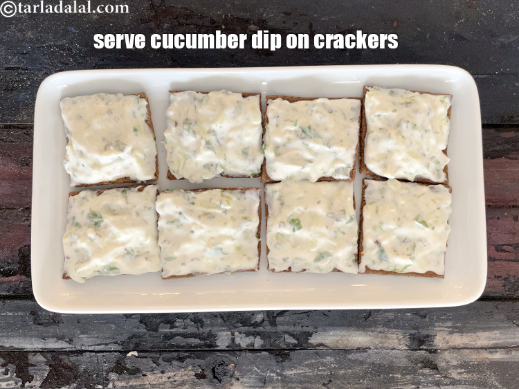 Step 19 – Serve <strong>cucumber dip | curd dip | Indian healthy kakadi dip |</strong> on crackers. We …