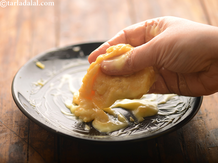Step 6 – Mixing the mixture with hands at each stage is important to make soft ladoos.&nbsp;